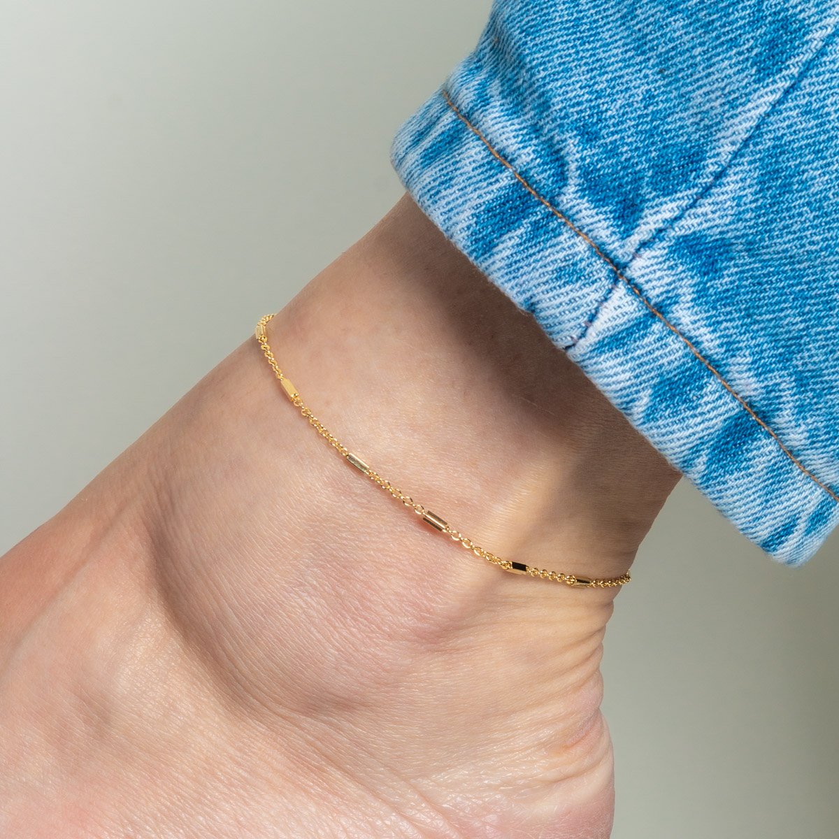 Tor-1163-Fo Tornozeleira Com Detalhes Tubulares Alongados.